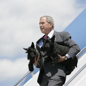 President George W. Bush Arrives at Andrews, AFB with his dogs Barney and Beazley in his arms