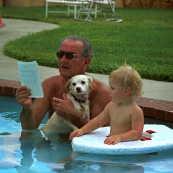 President Lyndon B. Johnson on his Birthday in Swimming Pool with his Dog and Grandson
