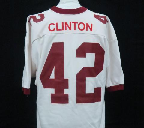 White football jersey, has Clinton and the number 42 on the back