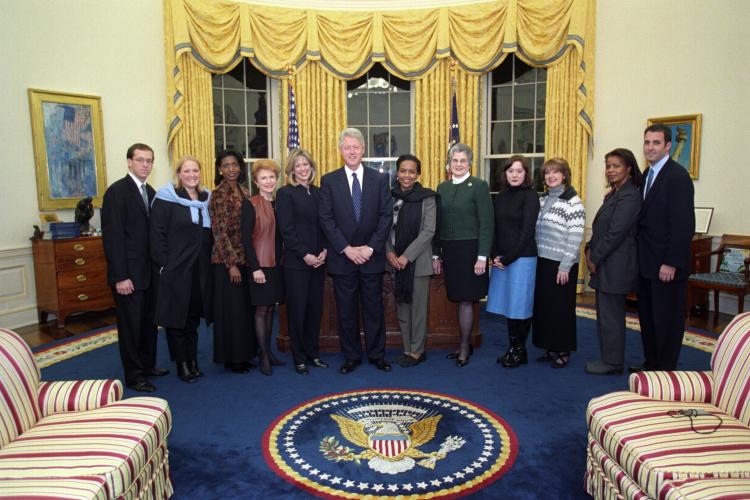 President Clinton joins Jason Cooper, Mary Morrison, Helen Robinson, Ann McCoy, Nancy Hernreich, Betty Currie, Janis Kearney, Doug Band and others from the Oval Office Operations Office for a group photo in the Oval Office