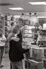 B. Dalton Bookstore Black and white photograph. President Clinton stands with his arm around his daughter, Chelsea Clinton, while looking at books