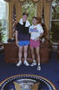 Cooling down after a jog President Clinton and Billy Webster pose for a photograph in the Oval Office after a jog along the Potomac River. President Clinton has a white towel wrapped around his neck. Both men stand. President Clinton his hand on Webster's shoulder. Webster holds a bottle of water in his hand.