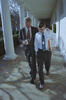 President Clinton and Billy Webster President Clinton and Billy Webster walk alone down the colonnade at the White house. President Clinton has his hand on Billy Webster's shoulder. With the other hand President Clinton holds a drink. Webster holds a file in his arms