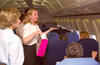 Flight to Guam First Lady Hillary Rodham Clinton talking with reporters and staff aboard her flight to Guam, enroute to China