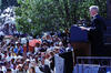 40th Anniversary of the Desegregation of Central High School President Clinton stands on a stage, behind a podium, looking out toward a crowd of people.