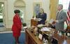 Meeting with the President in the Oval Office President Clinton, Stephanie Streett, and Minyon Moore work while standing around the Resolute Desk in the Oval Office.