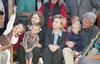 President Clinton, First Lady Hillary Rodham Clinton and Chelsea Clinton sit in a crowd of Kosovar refugee children in Stenkovic 1 Refugee Camp near Skopje, Macedonia
