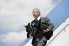 President George W. Bush Arrives at Andrews, AFB with Barney and Beazley President George W. Bush Arrives at Andrews, AFB with his dogs Barney and Beazley in his arms