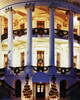 The South Portico of the White House decorated with garland, wreaths, and lighted trees.