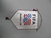 A white satin-like souvenir pennant hangs vertically against a plain light grey background, suspended by a thin gold chain attached to a horizontal metal rod at the top. The pennant features the word "FIFA" printed in large, black block letters at the top. Below this, the official 1994 FIFA World Cup logo is displayed, featuring a blue soccer ball with trailing red and blue stripes resembling a flag. The text "WorldCupUSA94" is printed underneath the logo in black and red. 