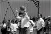 President Plays Basketball President Bill Clinton plays basketball with Secretary of Commerce Ron Brown and neighborhood boys at "The Playground" basketball court and shoe store