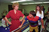 Arkansas Children's Hospital in Little Rock First Lady Hillary Rodham Clinton visiting the Arkansas Children's Hospital in Little Rock. The First Lady encourages a little boy in a physical therapy room while he is using parallel bars