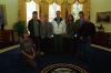 President Clinton poses for a photo with members of the rock band Pearl Jam, and others in the Oval Office. Present for the photo include, Stone Gossard, Jeff Ament, Mike McCready, Eddie Vedder, John Hoyt, Pyramid Communications, and Kelly Curtis, band manager