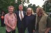 President Clinton poses for a photo on the South Lawn with musicians Stephen Stills, David Crosby, and Graham Nash