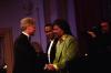 President Clinton greets musician Little Richard and Luther Vandross on stage at the Ford's Theatre Gala in Washington, DC.