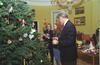 President Clinton, First Lady Hillary Rodham Clinton and Chelsea Clinton all stand, decorating the Family Christmas Tree