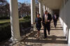 President Clinton walks with Alexis Herman along a colonnade