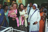Orphanage in New Delhi, India, Hillary Rodham Clinton and Chelsea Clinton hold babies at Mother Teresa's Orphanage in New Delhi, India
