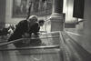 Affirmative Action Speech Black and white phtograph. President Clinton and Vice President Gore read the United States Constitution on display in the rotunda at the National Archives in Washington, D.C. prior to the President's speech on affirmative action.