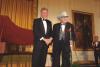 President Clinton joins blue grass musician Bill Monroe on stage on the State Floor during a performance at the National Medal of Arts dinner