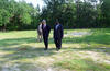 President Clinton walks in a vacant lot which was the former site of Mt. Zion AME Church
