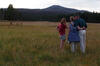 Yellowstone National Park President Clinton, Hillary Rodham Clinton, and Chelsea Clinton admire the mountains in the background while hiking in the Yellowstone National Park. The stand with there backs to the photographs. The President and First Lady have their arms around each other.