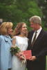 Chelsea's High School Graduation President Clinton, Hillary Rodham Clinton, and Chelsea Clinton pose for a photograph at Chelsea Clinton's high school. President Clinton and Chelsea look at each other and both hold Chelsea Clinton's High School diploma. Chelsea Clinton holds a bouquet of flowers.
