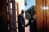 President Clinton holds the door open to Central High and greets Elizabeth Eckford as she enters the school