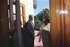 President Clinton holds the door open to Central High and greets Melba Pattillo Beals as she enters the school