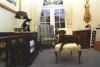 Socks the cat and Buddy the dog rest in the Outer Oval Office of the White House. Socks stares at buddy from the top of a television set