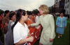 Shanghai No. 3 Girls School Hillary Rodham Clinton shakes hands with girls from the Shanghai No. 3 Girls School in Shanghai, China. The Girls hold a sign that reads, "First Lady of the United States of America"