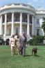 The President, First Lady, and Chelsea walk to Marine One with Buddy the Dog on the South Lawn of the White House