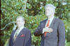 President Clinton and President Václav Havel of the Czech Republic stand for the United States National Anthem on the dais on the South Lawn. President Clintonlooks up and to the left and places his right hand over his chest.