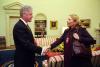 Musician Joni Mitchell greets President Clinton in the Oval Office