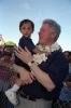 Address to the People of Guam President Clinton holds a young boy in his arms following his address to the people of Guam