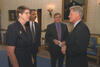 President Clinton stands with Attorney General, Janet Reno; Deputy Attorney General, Eric Holder; and Lawyer, Bill McBride in the Blue Room