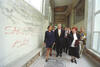 President Clinton tours Third High School in Sarajevo, Bosnia-Herzegovina. The President is accompanied by the school's principal, Adnan Memic. The walls of the school have been graffitied