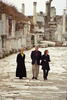 Ephesus President Clinton, Hillary Rodham Clinton, and Chelsea Clinton walk together along the ancient streets of Ephesus, Turkey. Ancient ruins of temple columns can be seen in the back ground.
