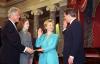 First Lady is Sworn In First Lady Hillary Rodham Clinton is sworn-in as a United States Senator for the State of New York. Vice President Al gore administers the oath of office. President Clinton and Chelsea Clinton smile as they hold the bible on which the First Lady takes her oath