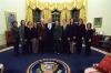 President Clinton joins Stephanie Streett and the staff of the Scheduling Office for a group photo in the Oval Office