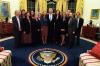 President Clinton joins the staff of the Millennium Council for a group photo in the Oval Office