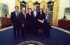 President Clinton joins the staff of the Environment Initiatives Office for a group photograph in the Oval Office