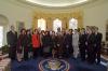 President Clinton joins the staff of the Presidential Personnel Office for a group photo in the Oval Office
