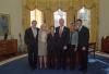 President Clinton joins the staff of the Staff Secretary's Office for a group photo in the Oval Office