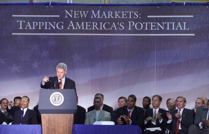 President Clinton delivers remarks to the North End community at the Artist Collective in Hartford, Connecticut. Platform guests include Governor John Rowland, Representative John Larson, Mayor Michael Peters and Reverend Jesse Jackson. This visit was a stop on the President's New Market tour