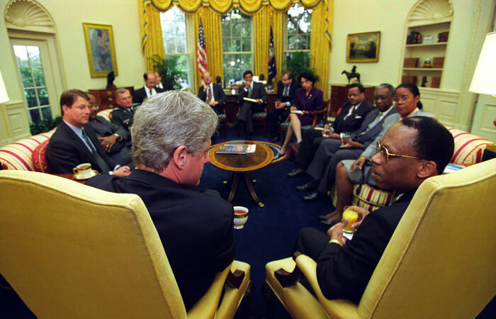 President Clinton meets with President Jean-Bertrand Aristide of Haiti in the Oval Office