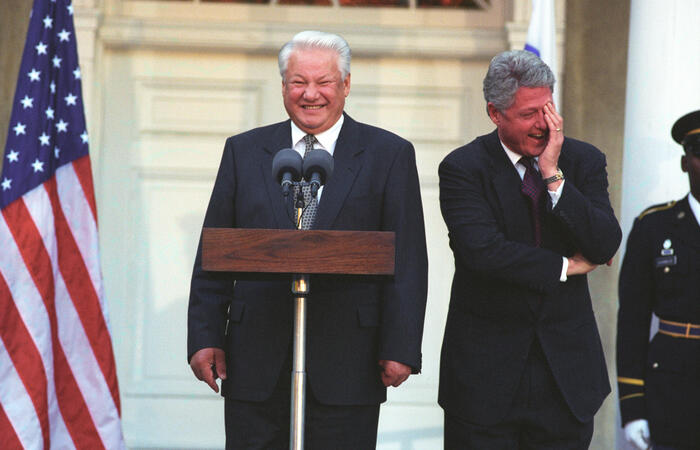 President Clinton breaks up laughing at a comment President Yeltsin of Russia makes about the press during a press conference at the Franklin D. Roosevelt Library in Hyde Park, NY
