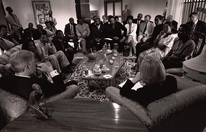 Black and white photo. President Clinton meets with Genocide Survivors and Future Builders in Kigali, Rwanda