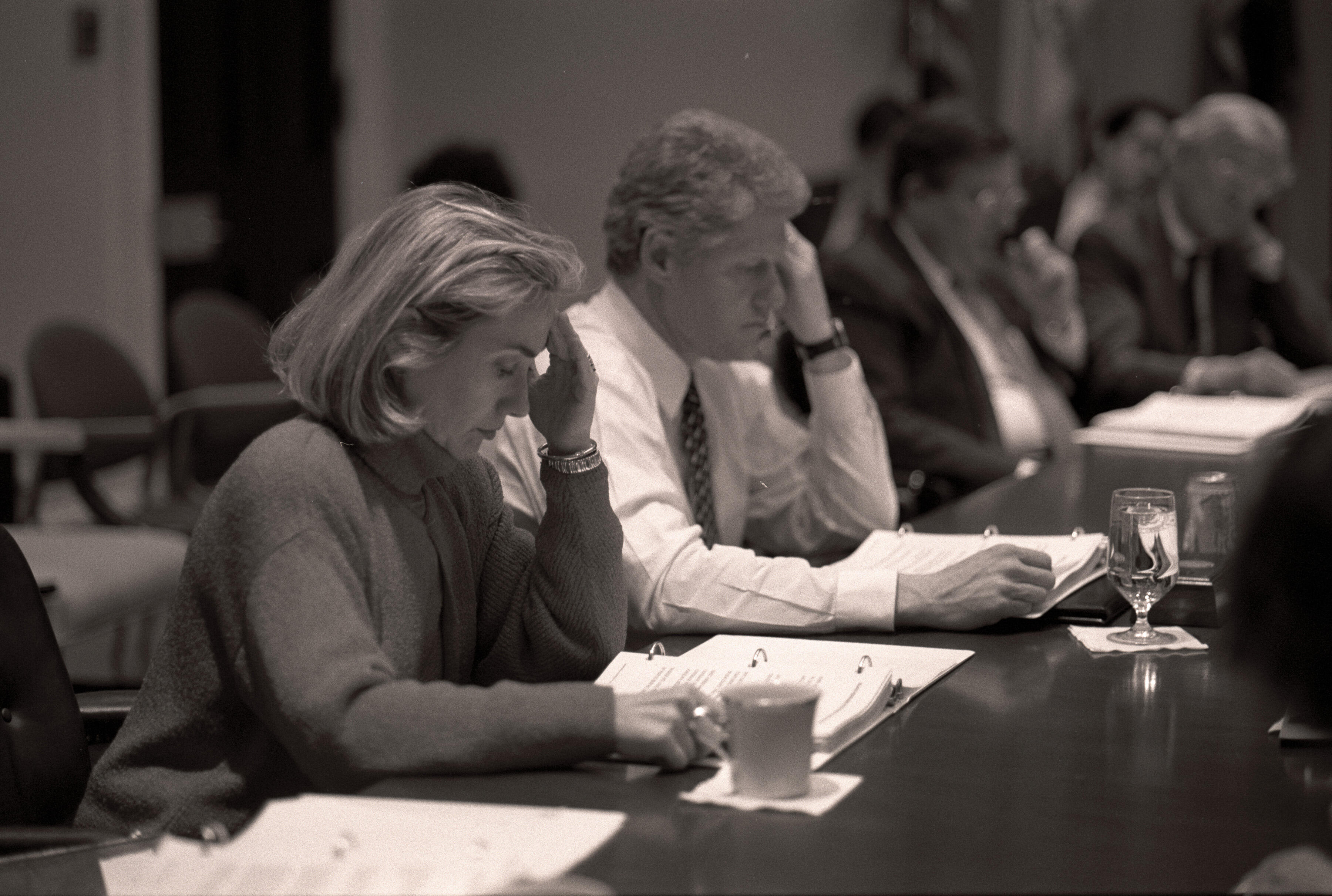 Black and white photograph. President William Jefferson Clinton, First Lady Hillary Rodham Clinton, Vice President Albert Gore and Mary Elizabeth "Tipper" Gore participating in a health care meeting in the Roosevelt Room. The other meeting participants are Secretary of Health and Human Services Donna Shalala, Carol Rasco, Judy Feder, Ira Magaziner, Alice Rivlin, Laura Tyson, Secretary of Labor Robert Reich, Secretary of the Treasury Robert Rubin, Leon Panetta, and Alan Binder