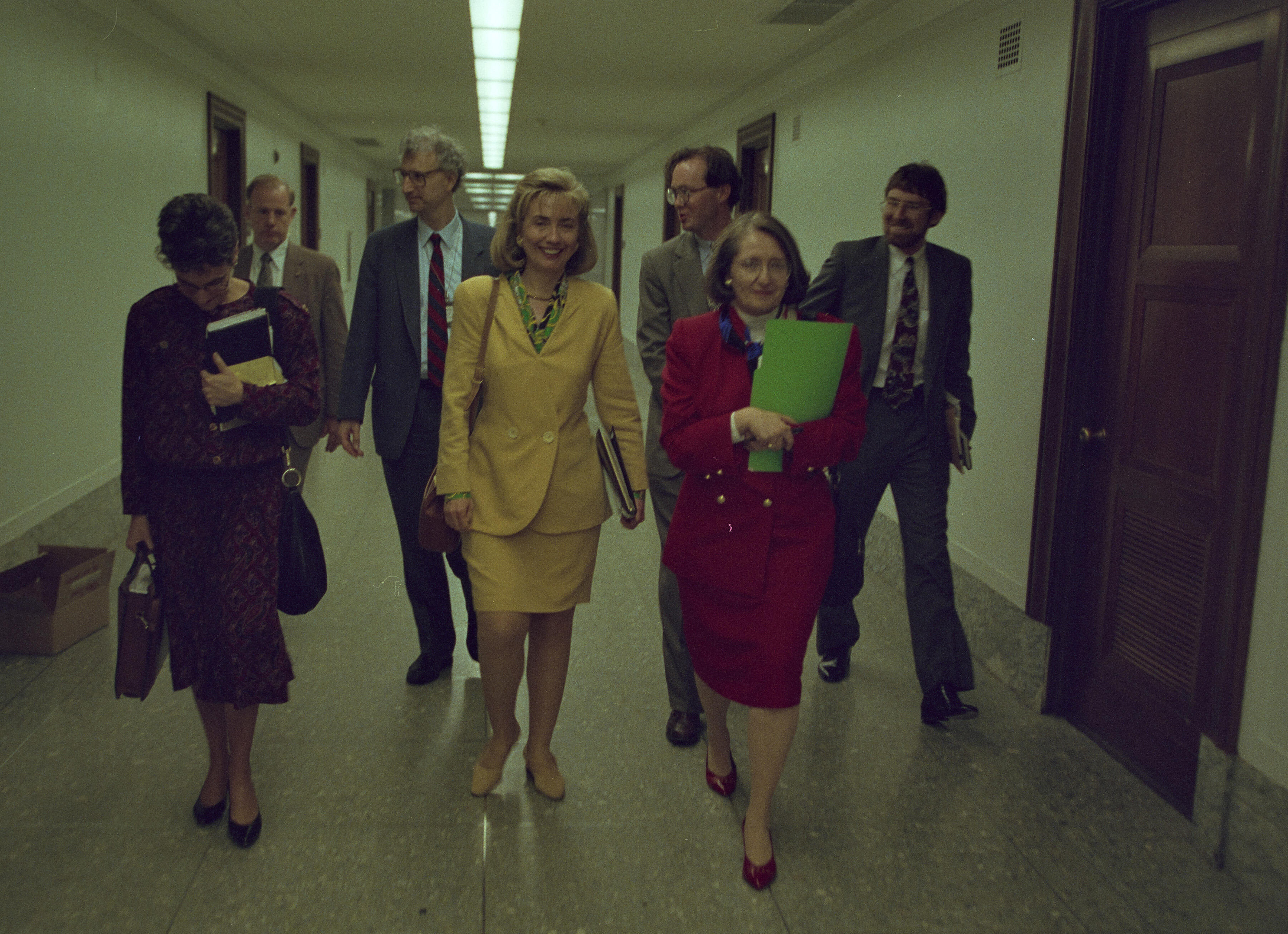 Hillary Rodham Clinton walking the hallways of the United States Capitol with Judy Feder, Melanne Verveer, Chris Jennings, Ira Magaziner and Neel Lattimore